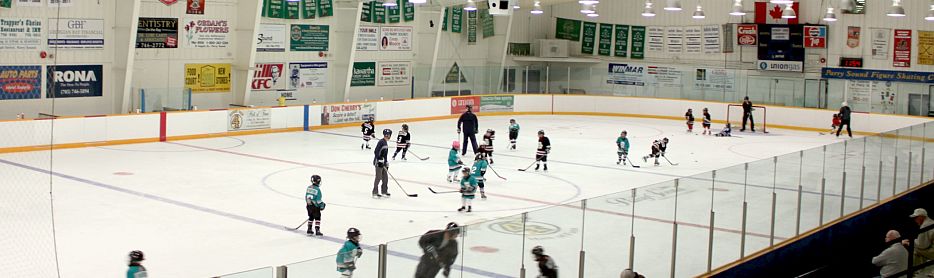 photo of kids playing hockey on the BOCC rink